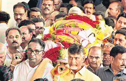 Andhra Pradesh Chief Minister N Chandrababu Naidu, along with former Supreme Court Judge J Chelameswar, shouldering the bier of his brother-in-law N Harikrishna, in Hyderabad on Thursday. Harikrishna died in a car accident on Wednesday | express