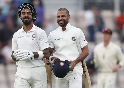 India's K. L. Rahul, left and India's Shikhar Dhawan smile as they walk off the pitch at the end of the first day of the fourth Test match between England and India at the Ageas Bowl in Southampton, England, Thursday, August 30, 2018. | AP