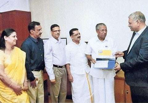 United India Insurance Company director K B Vijay Srinivas handing over two cheques of D1 crore each to CM Pinarayi Vijayan in the presence of Minister K T Jaleel, deputy general manager( Kochi) T K Haridasan, regional manager(Kochi) V Mohivannan and Thir