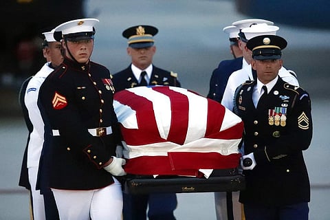 The flag-draped casket of Sen. John McCain, R-Ariz., is carried by an Armed Forces body bearer team to a hearse, August 30, 2018, at Andrews Air Force Base (Photo | AP)