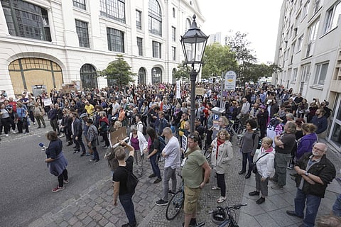People attend a demonstration against racism in front of the state agency of the German state of Saxony in Berlin, Germany. (Photo | AP)