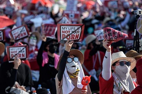 Female protesters shout slogans during a rally against 'spy-cam porn' in central Seoul. (Photo | AFP)