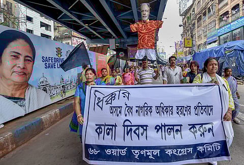 TMC party activists participate in a rally to observe 'Black Day' protesting against the alleged 'manhandling and harrassment' of their party delegation at Silchar airport in Kolkata on August 4 2018. (Photo | PTI)