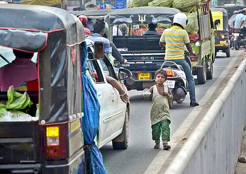 A small child begging on the street near Kalpana Square in Bhubaneswar. Image used for representational purpose only. (Express Photo by Biswanath Swain)