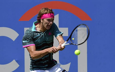 Defending champion Alexander Zverev, of Germany, returns the ball to Stefanos Tsitsipas during the semifinal round of the Citi Open tennis tournament in Washington, Saturday, Aug. 4, 2018. (AP Photo/Susan Walsh)
