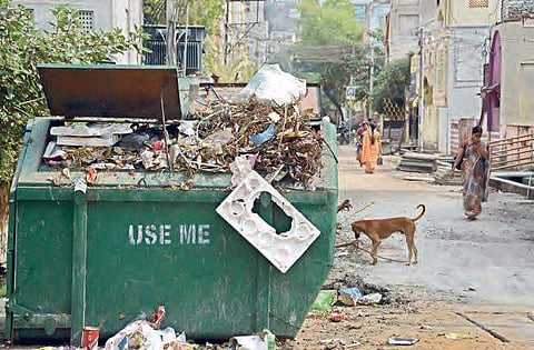 Image of overflowing garbage bins for representational purpose