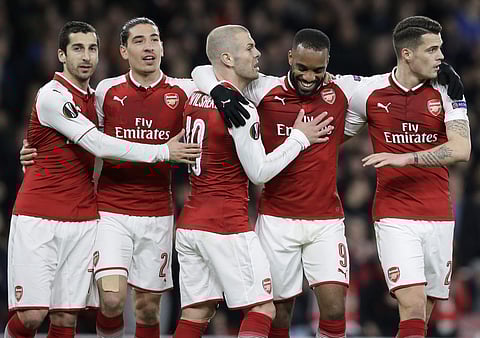Arsenal players celebrate a goal in the Europa League. (File Photo | AP)