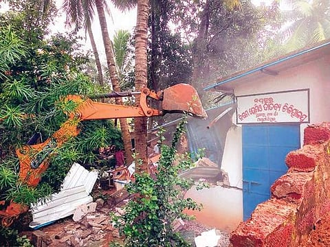 An illegal construction being demolished by the civic body near Science Park in Bhubaneswar on Monday I Express