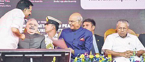 President Ram Nath Kovind and Governor P Sathasivam smile as Opposition leader Ramesh Chennithala hands over a representation in Thiruvananthapuram on Monday. Chief Minister Pinarayi Vijayan is also seen | B P Deepu