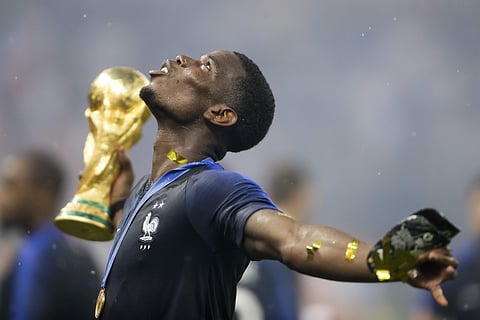 France's Paul Pogba celebrates with the trophy after the final match between France and Croatia at the 2018 soccer World Cup in the Luzhniki Stadium in Moscow, Russia, Sunday, July 15, 2018. ( File Photo | AP)