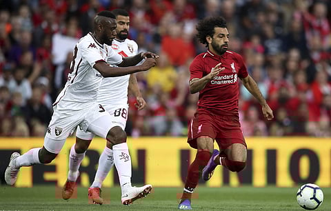 Torino's Nicolas N'Koulou, left, and Armando Izzo, center, give chase to Liverpool's Mohamed Salah during the pre-season soccer match between Torino and Liverpool at Anfield, Liverpoo, England, Tuesday, Aug. 7, 2018. | AP