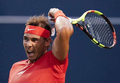 Rafael Nadal, of Spain, returns a shot to Benoit Paire, of France, during the men’s tennis tournament in Toronto. (Photo | AP)