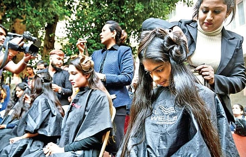 Students donate their hair during a drive at Mount Carmel College as part of a campaign to spread awareness on cancer in Bengaluru on Wednesday | Pushkar V
