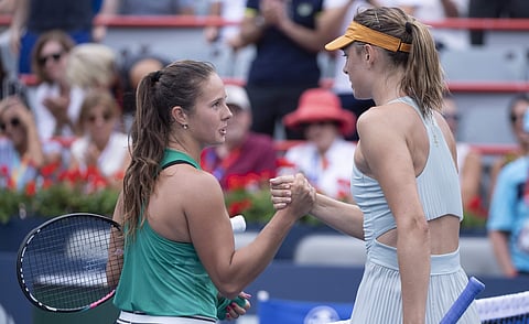 Daria Kasatkina, left, of Russia, congratulates compatriot Maria Sharapova for her victory during the Rogers Cup women's tennis tournament, Wednesday, Aug. 8, 2018, in Montreal. | AP