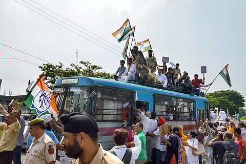 Detained Congress Party workers raise slogans during 'Bharat Bandh' protest called by Congress and other parties against fuel price hike and depreciation of the rupee in Jammu Monday Sept 10 2018. | PTI