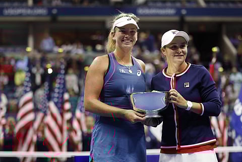 CoCo Vandeweghe, left, and Ashleigh Barty, of Australia, hold the trophy after defeating Timea Babos, of Hungary, and Kristina Mladenovic, of France,in the women's double final of the U.S. Open tennis tournament,Sept. 9, 2018, in New York. (Photo | AP)