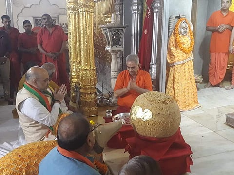 Amit Shah went to the temple from the airport with a delegation, including BJP's Rajasthan unit president Madan Lal Saini. (Photo| Twitter/ BJP Rajasthan)
