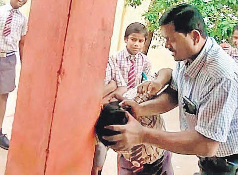 Principal Venkataramana thrashes a student at AP Tribal Welfare Residential Boys’ School at Dargamitta in Nellore