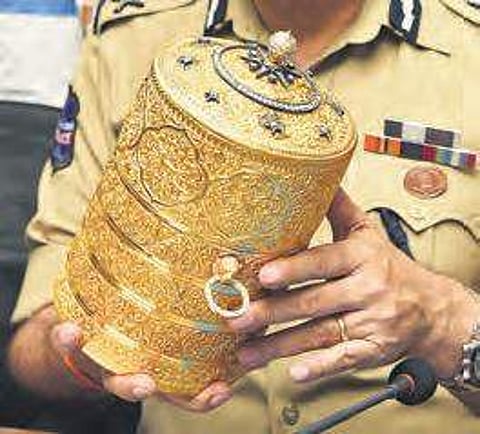 The golden tiffin box retrieved from the burglars | R Satish Babu