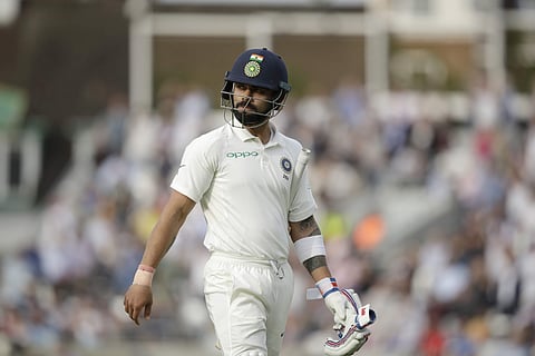 India captain Virat Kohli walks off the field of play after losing his wicket from the bowling of England's Stuart Broad during the fifth Test match of a five-match series between England and India at the Oval cricket ground in London, Monday, Sept. 10, 2