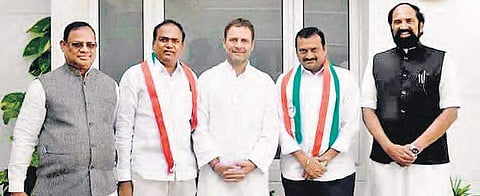 Congress president Rahul Gandhi along with TPCC chief Uttam Kumar Reddy, AICC secretary RC Khuntia along with film producer Bandla Ganesh and TRS MLC Bhupathi Reddy, who joined the Congress in New Delhi, on Friday | Express