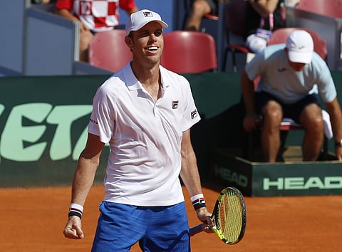 Sam Querrey of the United States celebrates after defeating Marin Cilic of Croatia in their Davis Cup semifinal singles match in Zadar. | AP