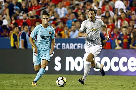 Barcelona midfielder Denis Suarez (L) | AP