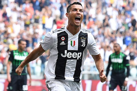 Juventus' Cristiano Ronaldo celebrates after scoring during a Serie A soccer match between Juventus and Sassuolo, at the Allianz Stadium in Turin. | AP