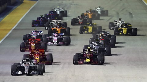 Mercedes driver Lewis Hamilton, left, of Britain leads the field at the start of the Formula One Grand Prix of Singapore at Marina Bay Street Circuit in Singapore. (Photo | AP)