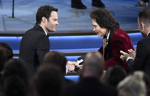 Teddy Perkins, right, congratulates Bill Hader as he gets ready to walk on stage to accept the award for outstanding lead actor in a comedy series for 'Barry' at the 70th Primetime Emmy Awards on Monday, Sept. 17, 2018. (Photo: AP)