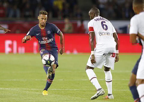 PSG's Neymar, left, challenge for the ball with Caen's Prince Oniangue during their League One match between Paris Saint-Germain and Caen at Parc des Princes stadium in Paris. (Photo | AP)