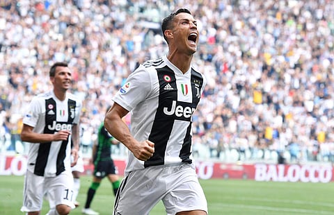 Juventus' Cristiano Ronaldo celebrates after scoring during a Serie A soccer match between Juventus and Sassuolo, at the Allianz Stadium in Turin, Italy, Sunday, Sept. 16, 2018. | AP