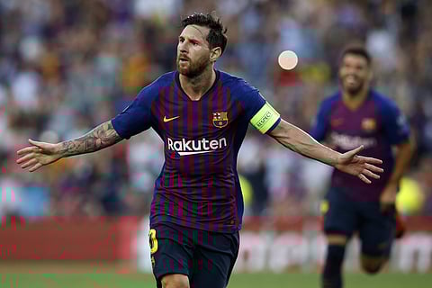 Barcelona forward Lionel Messi celebrates after scoring the opening goal of his team during the group B Champions League soccer match between FC Barcelona and PSV Eindhoven at the Camp Nou stadium in Barcelona, Spain, Tuesday, Sept. 18, 2018. | AP
