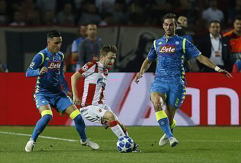Red Star's Marko Marin, center, is challenged by Napoli forward Jose Callejon, left, and Fabian Ruiz, during the Champions League group C soccer match between Red Star and Napoli, in Belgrade, Serbia, Tuesday, Sept. 18, 2018. | AP