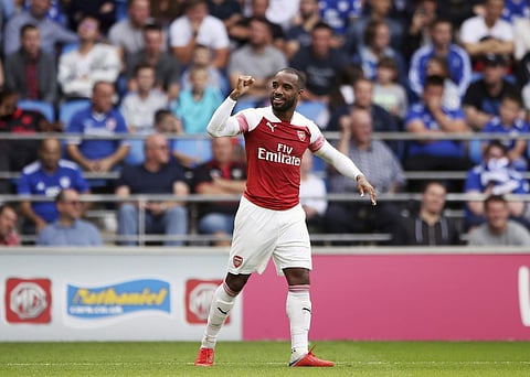 Arsenal's Alexandre Lacazette after scoring his side's third goal during a Premier League soccer match between Cardiff City and Arsenal, at the Cardiff City Stadium. | AP