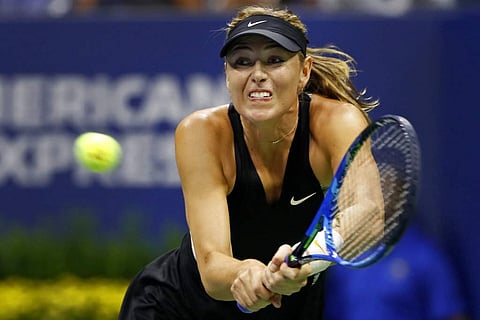 Maria Sharapova, of Russia, returns a shot to Jelena Ostapenko, of Latvia, during the third round of the U.S. Open tennis tournament, Sept. 1, 2018, in New York. (Photo | AP)