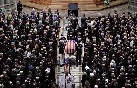 The family of Sen. John McCain, R-Ariz., follows as his casket is carried at the end of a memorial service at Washington National Cathedral in Washington, September 1, 2018. (Photo | AP)