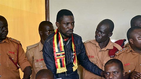Bobi Wine was stopped while trying to board a flight at Entebbe airport. (Photo | AP)