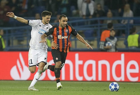 Hoffenheim midfielder Florian Grillitsch, left, and Shakhtar defender Ismaily Ismaily challenge for the ball during the Group F Champions League soccer match between Shakhtar Donetsk and Hoffenheim at the Metalist Stadium in Kharkiv, Ukraine, Wednesday, S