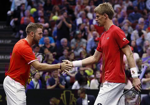 Team World's Jack Sock, left, and Kevin Anderson celebrate a point during a doubles tennis match against Team Europe's Roger Federer and Novak Djokovic at the Laver Cup. (Photo | AP)