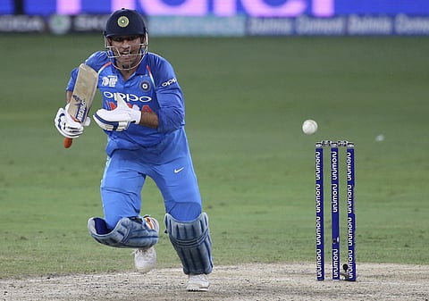 India's Mahendra Singh Dhoni reacts after playing a shot during the one day international cricket match of Asia Cup between India and Bangladesh in Dubai, United Arab Emirates, Friday, Sept. 21, 2018. | AP