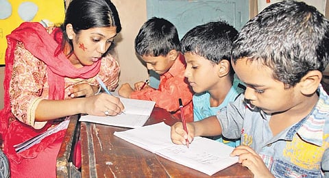Representative picture of children being taught to write