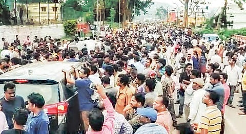 The rally taken out by the supporters of MLA Kidari Sarveswara Rao at Araku main road; (below) agitators set vehicles on fire at Araku police station in Visakhapatnam district on Sunday | G Satyanarayana