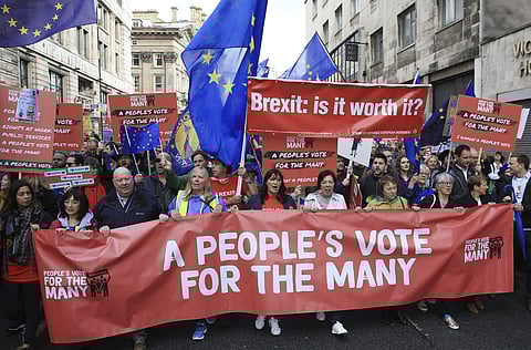 Members of the public march in support of the People's Vote campaign in Liverpool, during the Labour Party's annual conference | AP