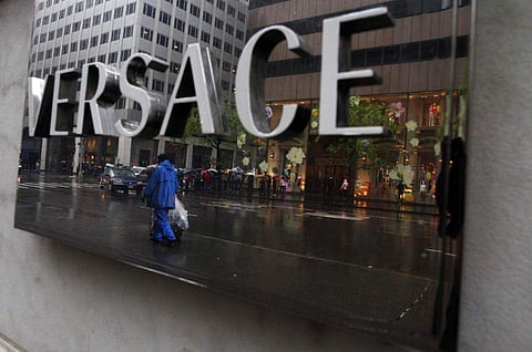 A sign is seen for high-end retail store Versace along 5th Avenue in New York. (Photo | Reuters)