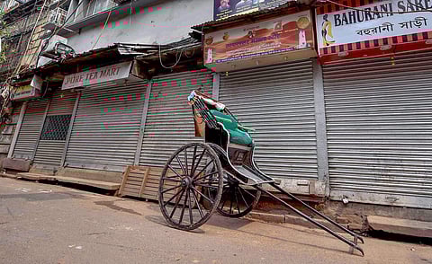 A hand pulled rickshaw stands in front of a closed market during 'Bangla Bandh' strike called by BJP against the State Government in Kolkata Wednesday Sept 26 2018. | PTI