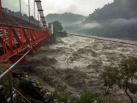 Chamba A damaged bridge is seen as heavy gush of flood water flows into Ravi river during incessant rainfall in Chamba Tuesday Sept 25 2018. (Photo | PTI)