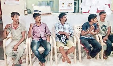People wait anxiously at the Red Cross Blood Bank in Srikakulam, to collect platelets on Tuesday