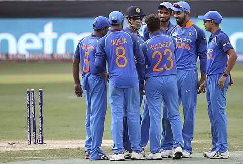 Mahendra Singh Dhoni, third left, celebrates with teammates. (Photo | AP)