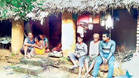 Grieving family of the farmer in front of his house | Express